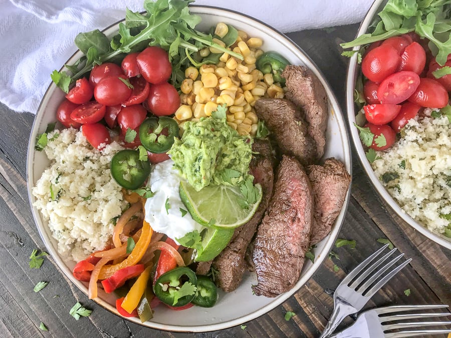 Steak Fajitas Bowls with Garlic Lime Cauliflower RIce Bowls | www.withpeanutbutterontop.com