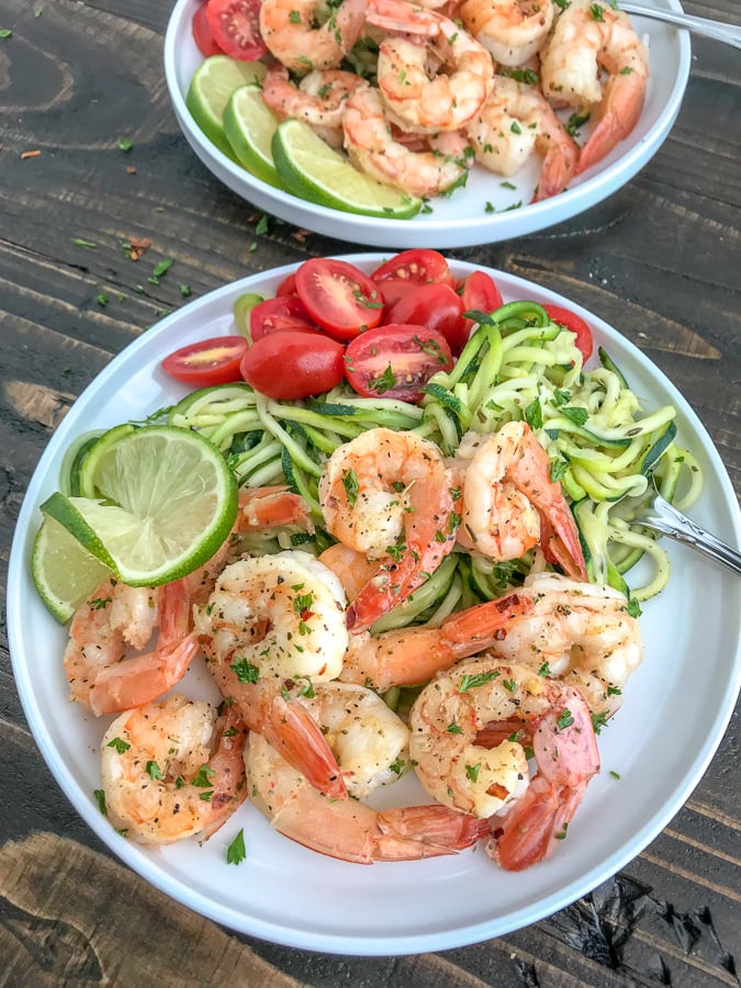 Garlic Honey Lime Shrimp and Zoodles -  the perfect low-carb, high-protein recipe that comes together in 15 minutes. Sweet, sticky, garlic lime cooked shrimp and zucchini noodles are the ultimate easy and healthy combination. #shrimp #zoodles #zucchininoodles #lowcarb #healthy | https://withpeanutbutterontop.com