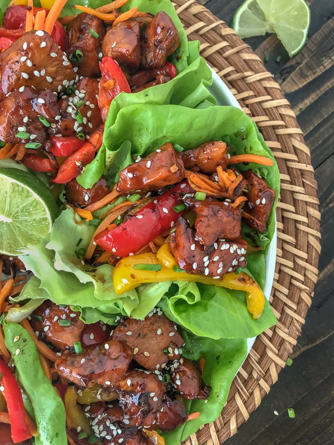 Honey Garlic Chicken Lettuce Wraps - low carb, sweet and savory, and full of flavor. #honeygarlicchicken #lowcarb #healthy #lettucewrap | https://withpeanutbutterontop.com