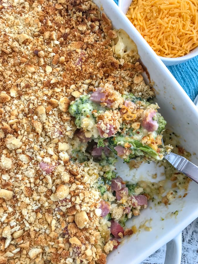 Cheesy Broccoli Ham Casserole - super simple and quick dinner option that your family is sure to love! Even the kiddos! #easydinners #broccoliandcheese #casserole | https://withpeanutbutterontop.com