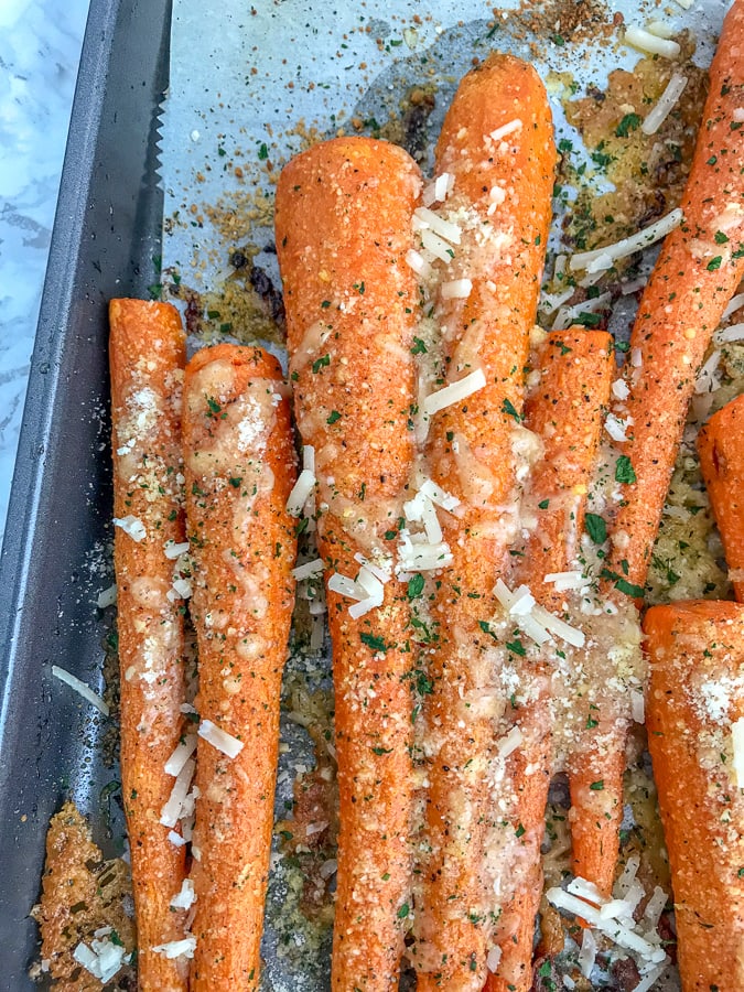 Garlic Butter Parmesan Roasted Carrots - cooked to a delicious and tender perfection. Very easy to make, flavorful, and the perfect side dish to any meal!