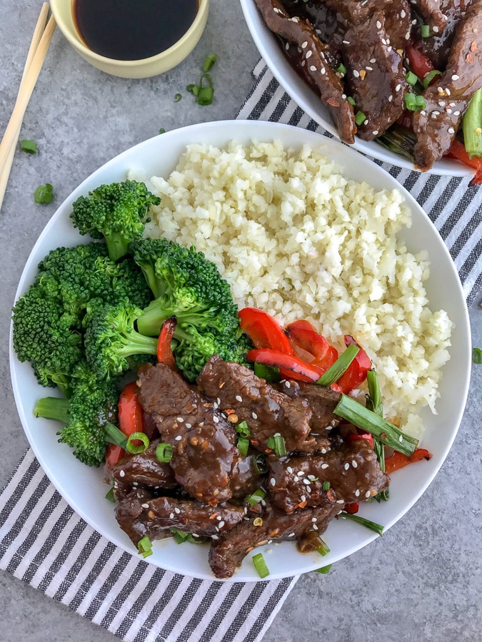 Better AND healthier than PF Chang's classic takeout dish! Full of flavor, but without the guilt! Super simple to make and guaranteed to wow your taste buds! #mongolianbeef #pfchangs #takeout #healthyrecipes #keto #lowcarb | https://withpeanutbutterontop.com